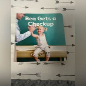 Lovevery Bea gets a checkup book